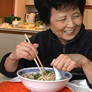 My mom eating noodle